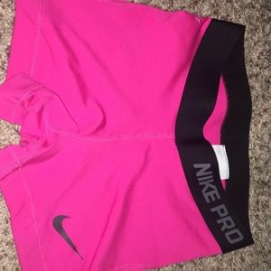 Pink and black nike pros